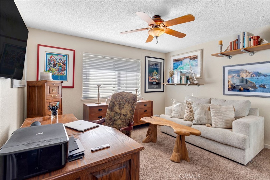 20360 Ituma Road Apple Valley, CA 92308 - Photo 30 of 66 a living room with furniture and a flat screen tv