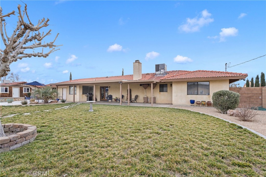 20360 Ituma Road Apple Valley, CA 92308 - Photo 50 of 66 a front view of a house with a yard