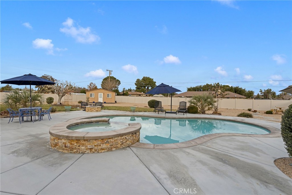 20360 Ituma Road Apple Valley, CA 92308 - Photo 58 of 66 a view of a swimming pool and outdoor space