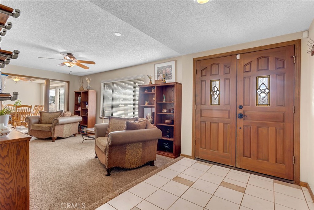 20360 Ituma Road Apple Valley, CA 92308 - Photo 8 of 66 a living room with furniture and a window
