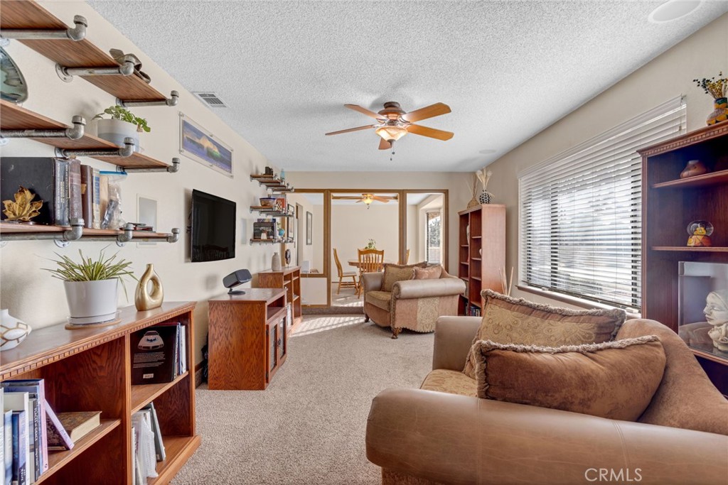 20360 Ituma Road Apple Valley, CA 92308 - Photo 9 of 66 a living room with furniture and a flat screen tv