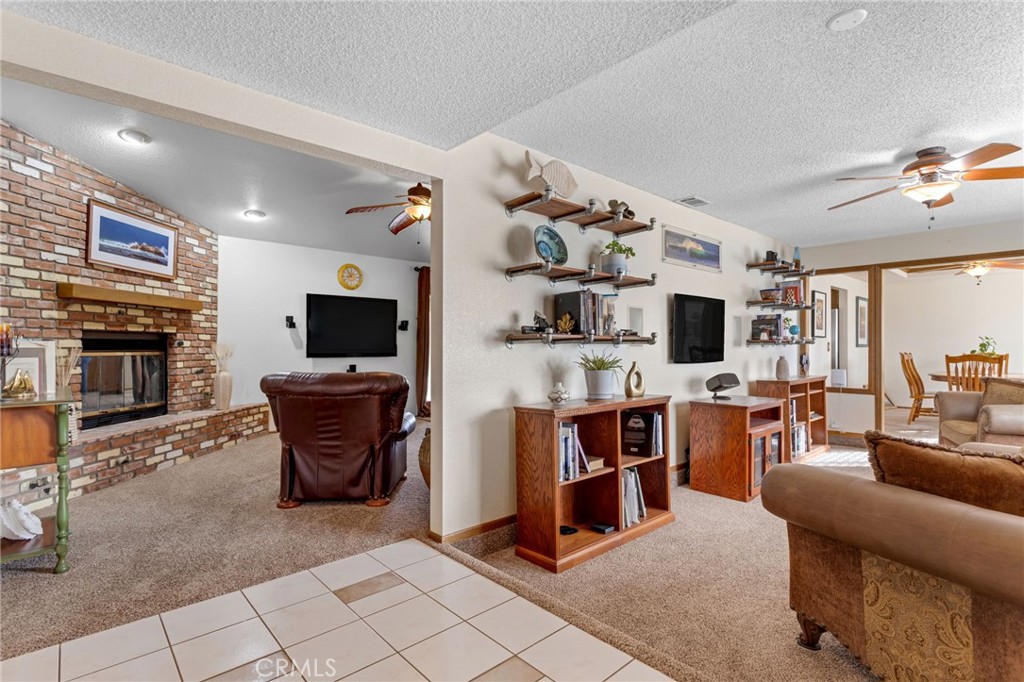 20360 Ituma Road Apple Valley, CA 92308 - Photo 10 of 66 a living room with furniture a flat screen tv and kitchen view