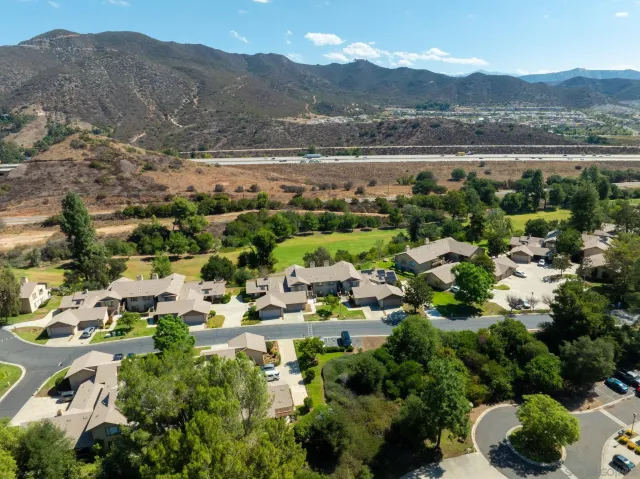 a view of a city with mountains in the background