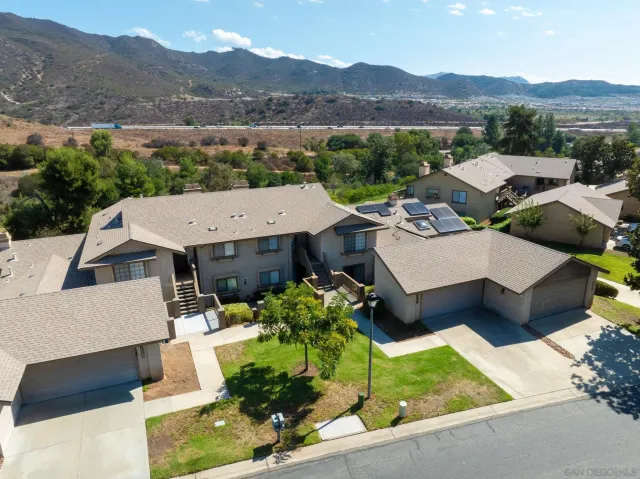 an aerial view of a house with a garden