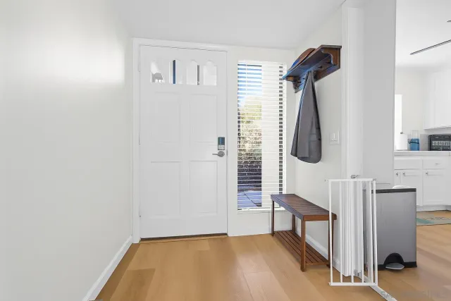 a view of entryway with wooden floor