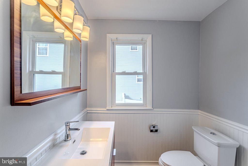 329 Union Avenue Runnemede, NJ 08078 - Photo 13 of 29 a bathroom with a sink a toilet and a window