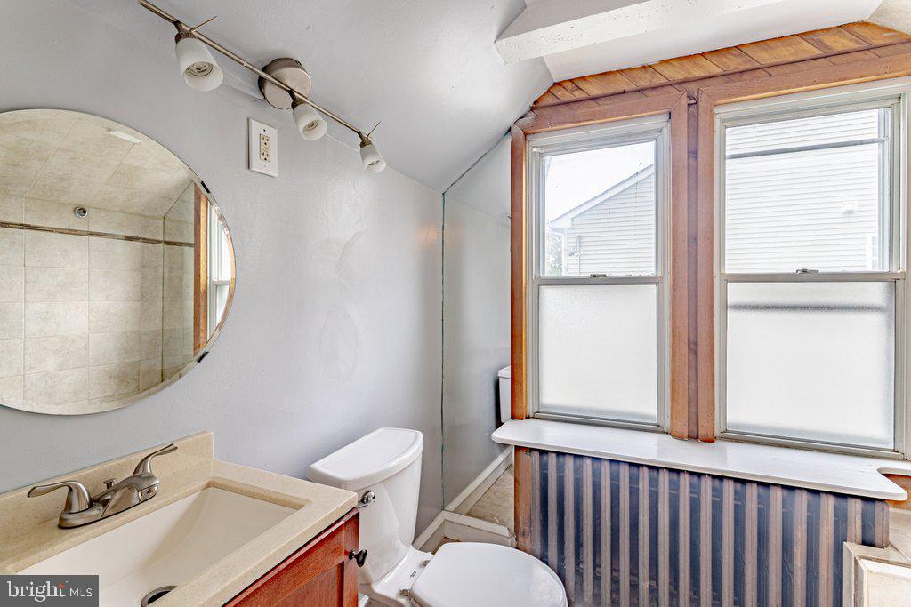 329 Union Avenue Runnemede, NJ 08078 - Photo 19 of 29 a bathroom with a sink a toilet and a mirror