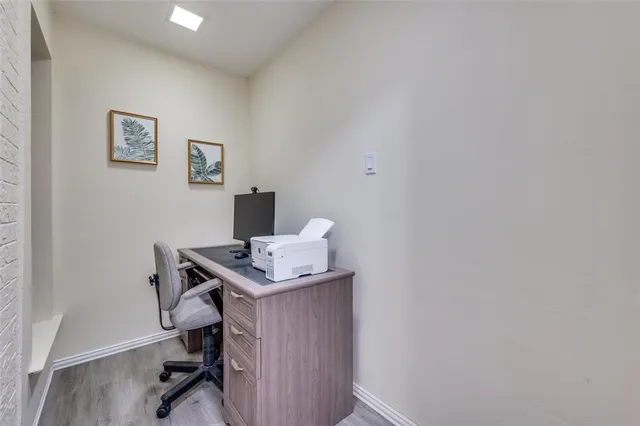 a view of a workspace with furniture