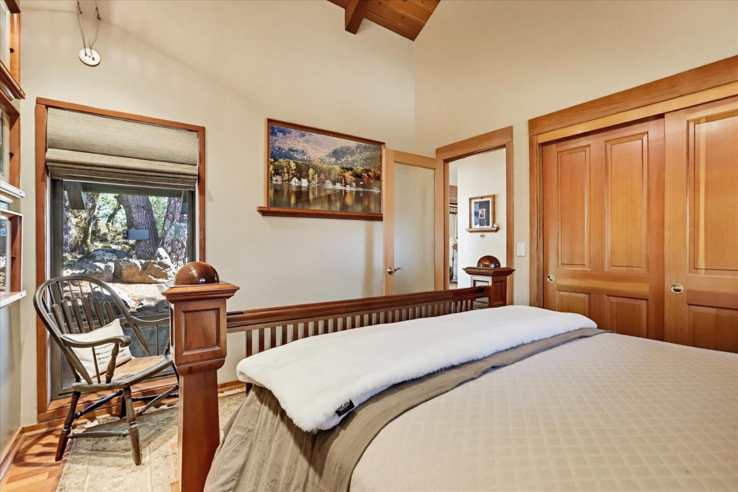 20111 Tanglewood Road Grass Valley, CA 95945 - Photo 30 of 93 a bedroom with a bed and wooden floor