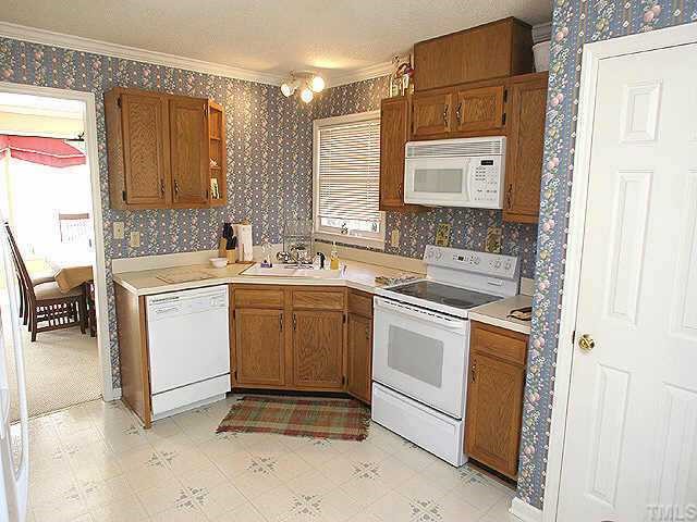 7109 Kinross Drive Raleigh, NC 27613 - Photo 4 of 9 a utility room with dryer and washer