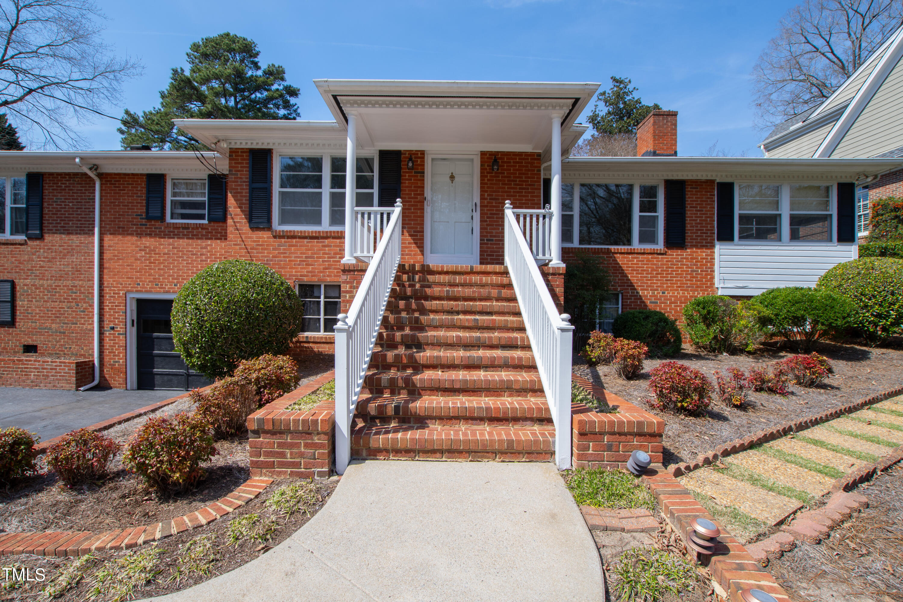 1725 Brooks Avenue Raleigh, NC 27607 - Photo 1 of 42 a front view of a house with a yard