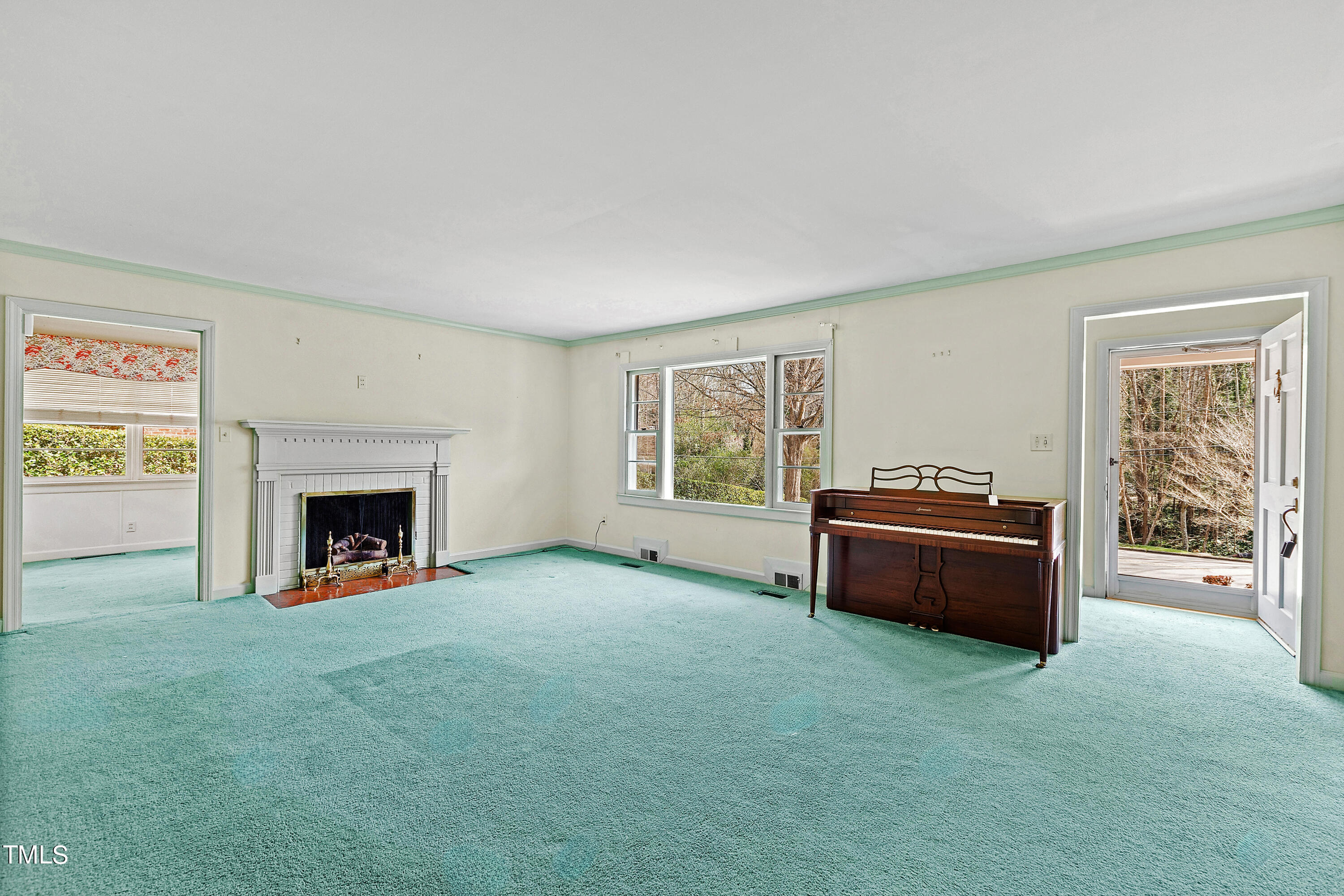 1725 Brooks Avenue Raleigh, NC 27607 - Photo 14 of 42 a living room with furniture and a fireplace