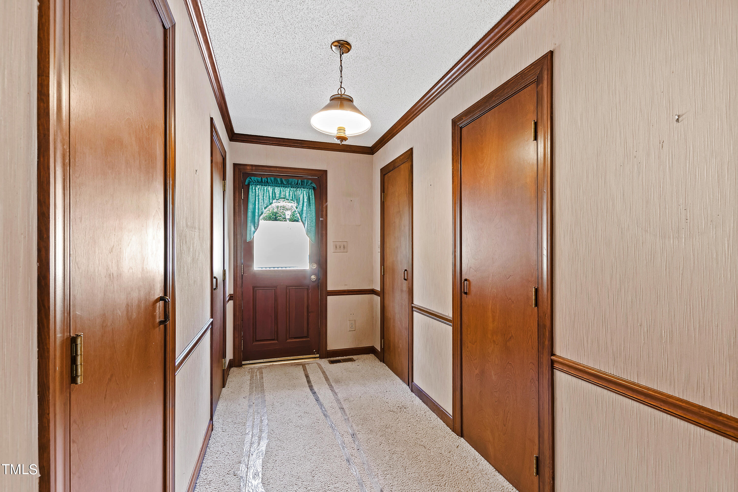1725 Brooks Avenue Raleigh, NC 27607 - Photo 19 of 42 a view of a hallway with a door and stairs