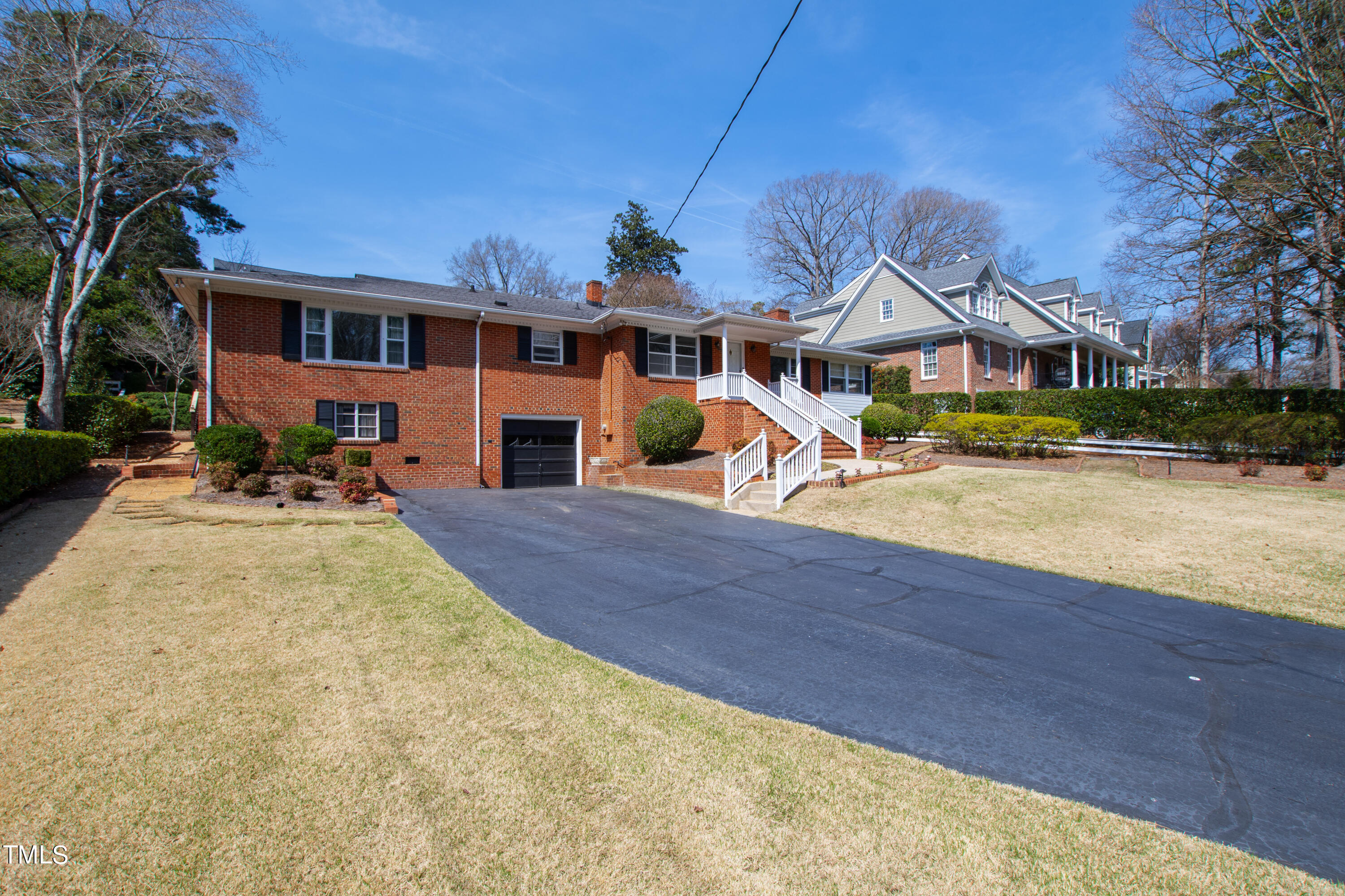 1725 Brooks Avenue Raleigh, NC 27607 - Photo 3 of 42 a front view of a house with a yard