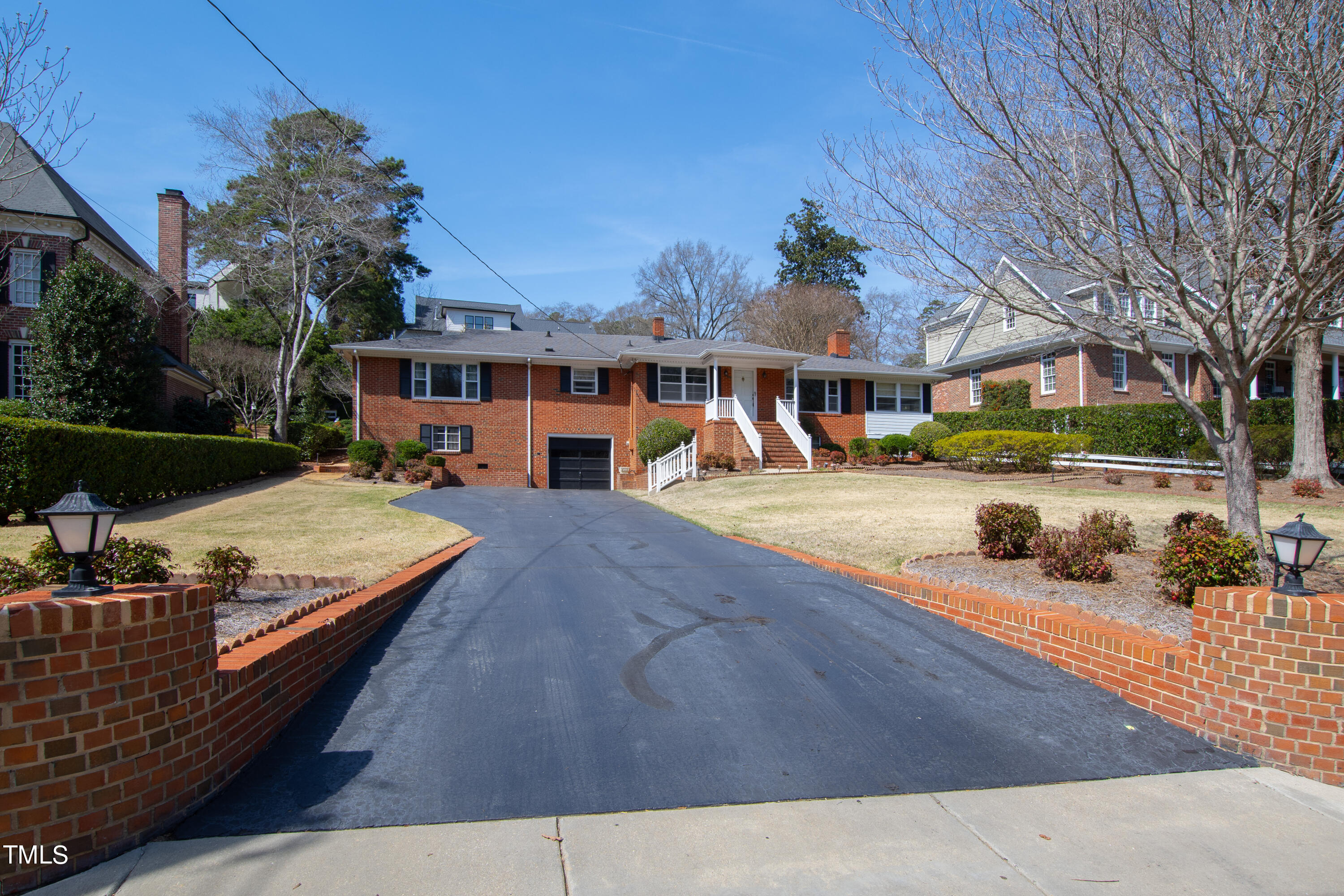 1725 Brooks Avenue Raleigh, NC 27607 - Photo 4 of 42 a view of a building with cars park
