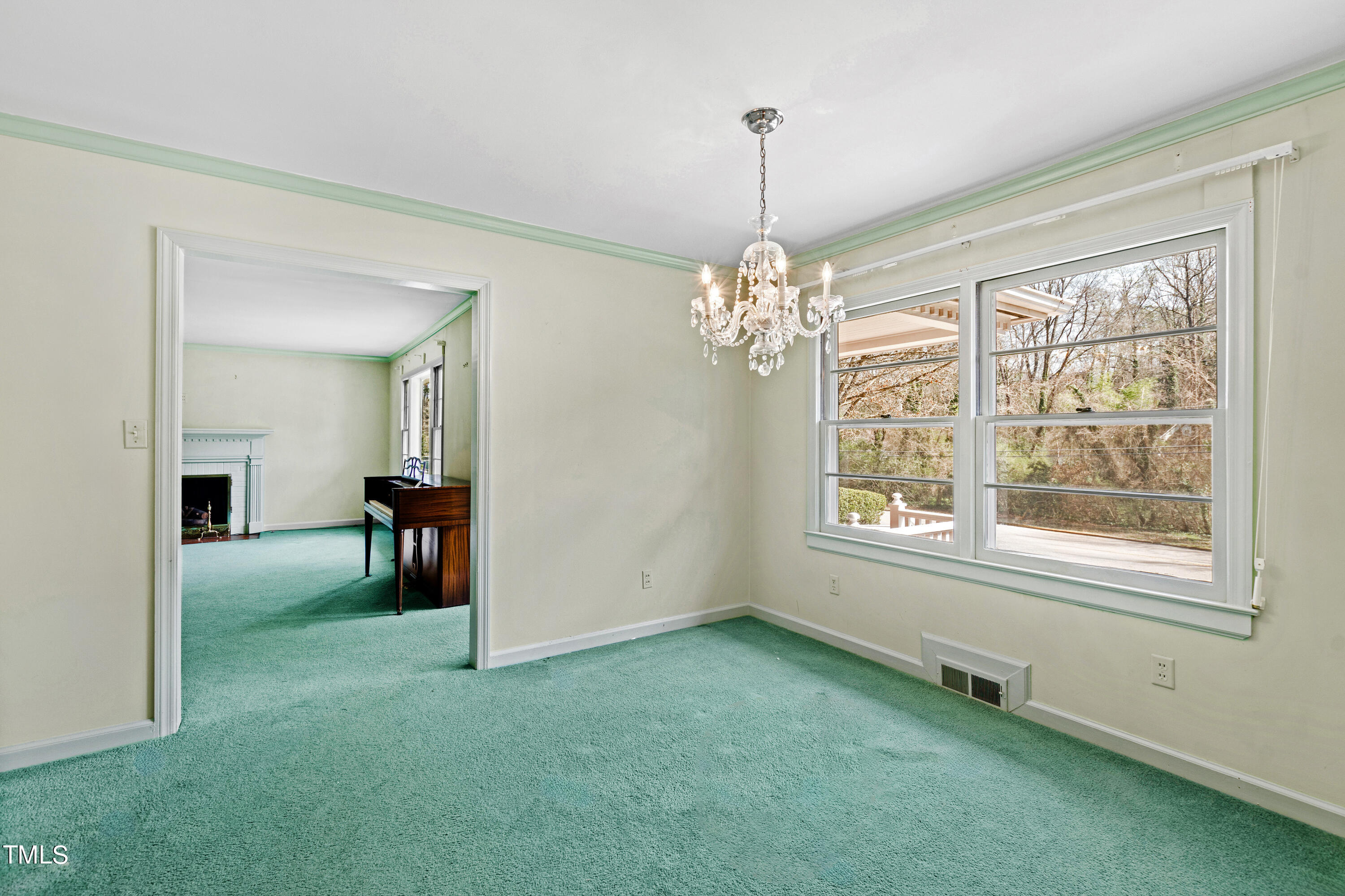 1725 Brooks Avenue Raleigh, NC 27607 - Photo 6 of 42 a view of an empty room with a window