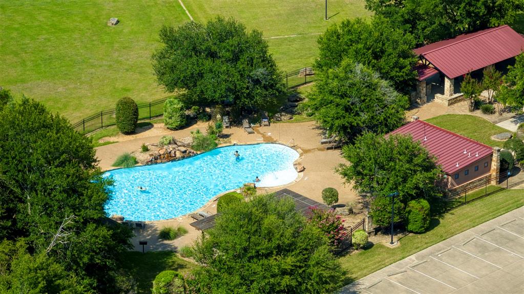 1044 Canyon Lake Road Wills Point, TX 75169 - Photo 9 of 10 a view of a yard with table and chairs under an umbrella