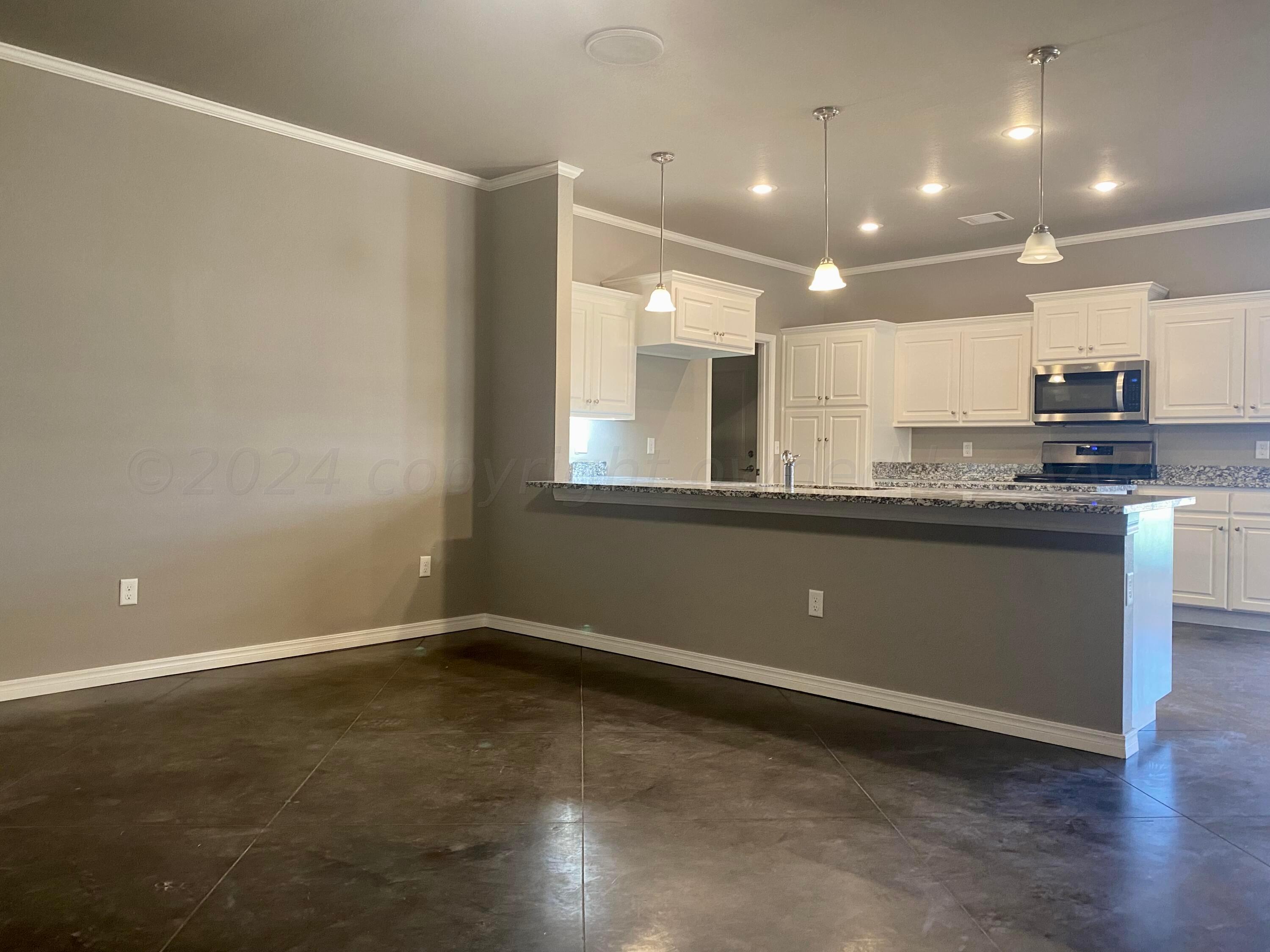 9608 Sydney Drive Amarillo, TX 79119 - Photo 3 of 22 Living Room & Kitchen