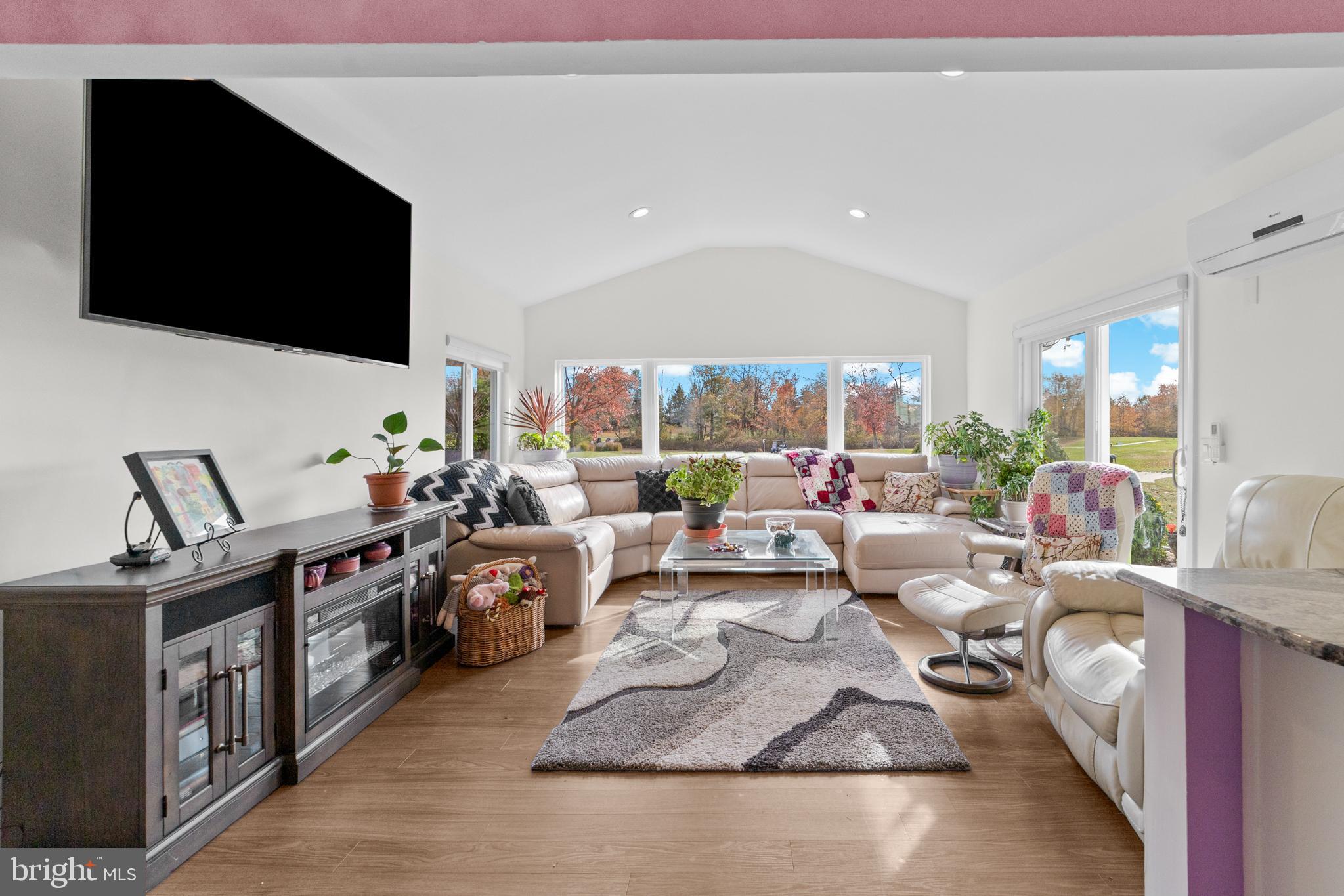 264A Glen Road Monroe Township, NJ 08831 - Photo 14 of 31 a living room with lots of furniture and a flat screen tv