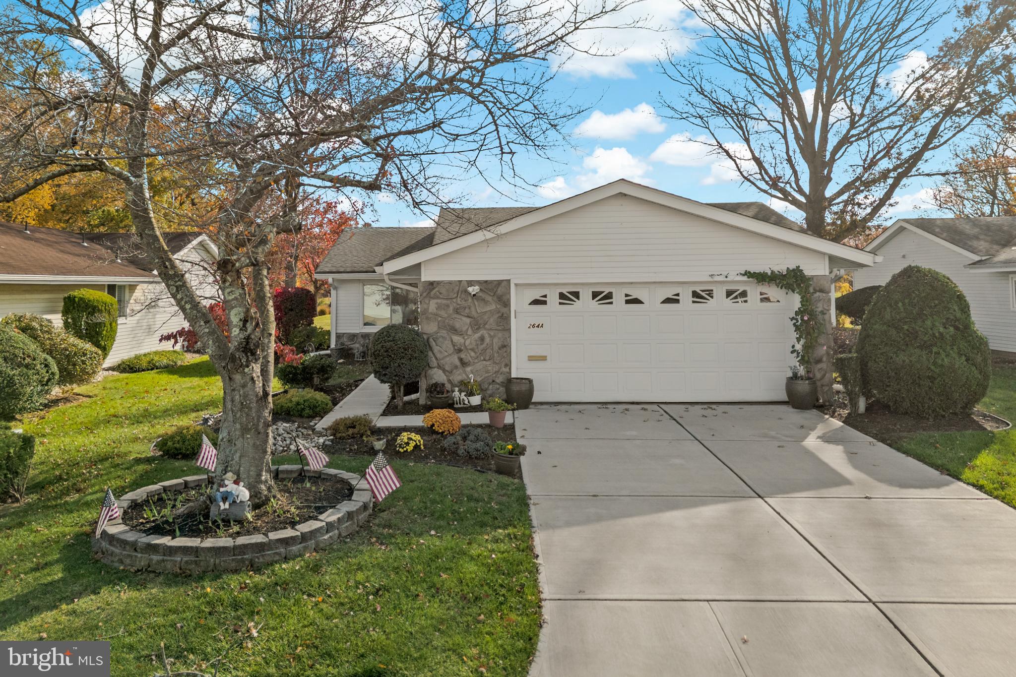 264A Glen Road Monroe Township, NJ 08831 - Photo 2 of 31 a front view of a house with a yard and trees