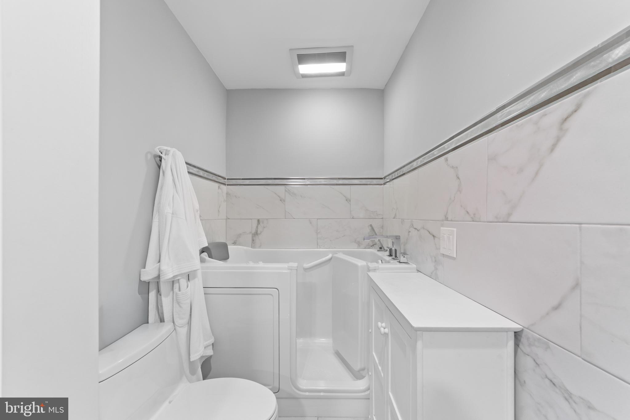 264A Glen Road Monroe Township, NJ 08831 - Photo 21 of 31 a bathroom with a sink a toilet and shower