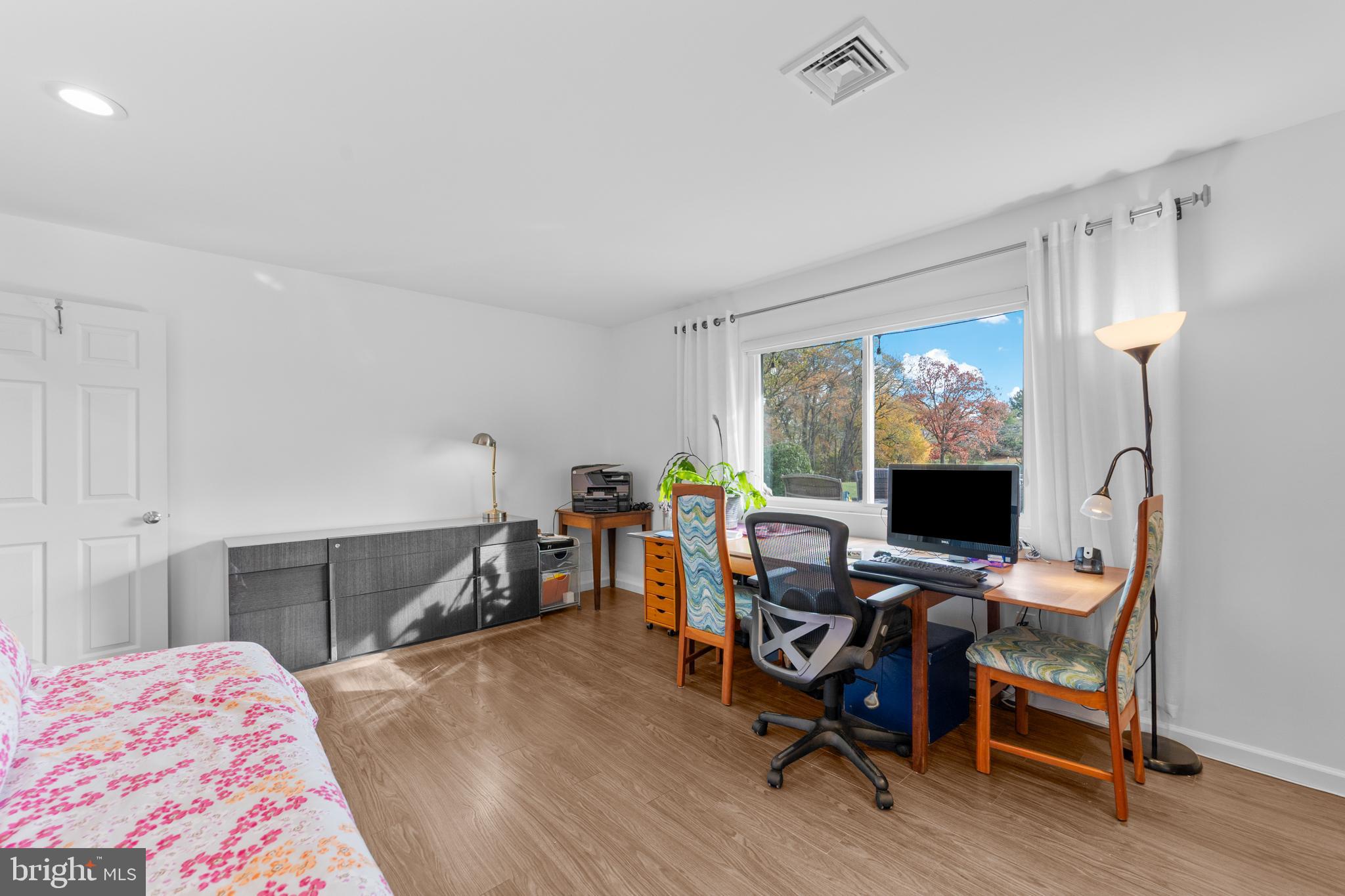 264A Glen Road Monroe Township, NJ 08831 - Photo 24 of 31 a view of a workspace with furniture and wooden floor