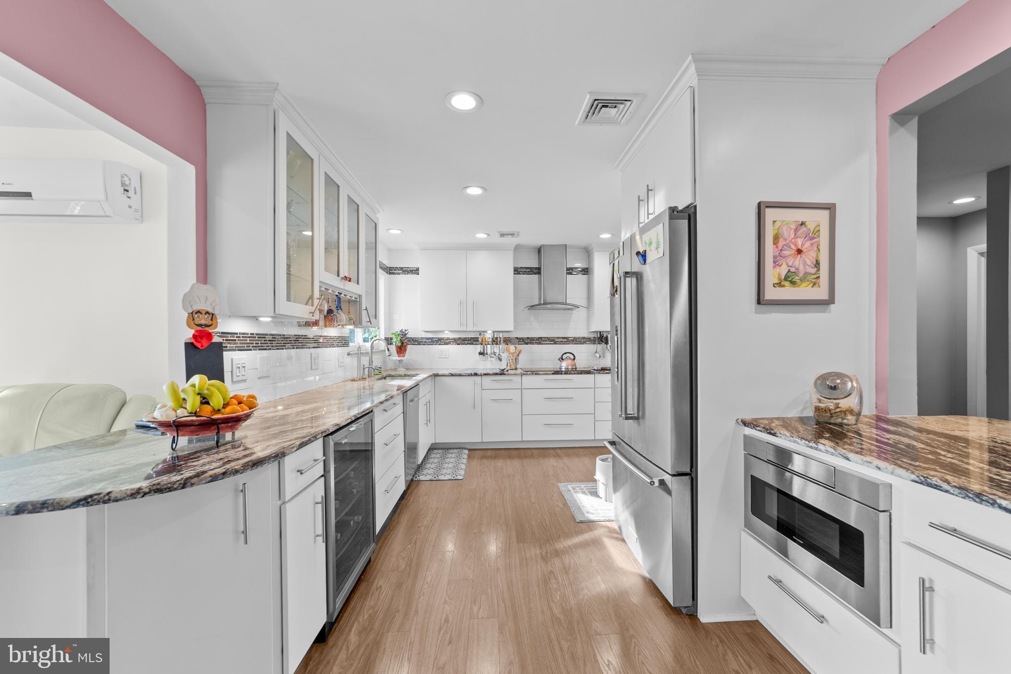 264A Glen Road Monroe Township, NJ 08831 - Photo 10 of 31 a kitchen with stainless steel appliances a stove a sink and a refrigerator