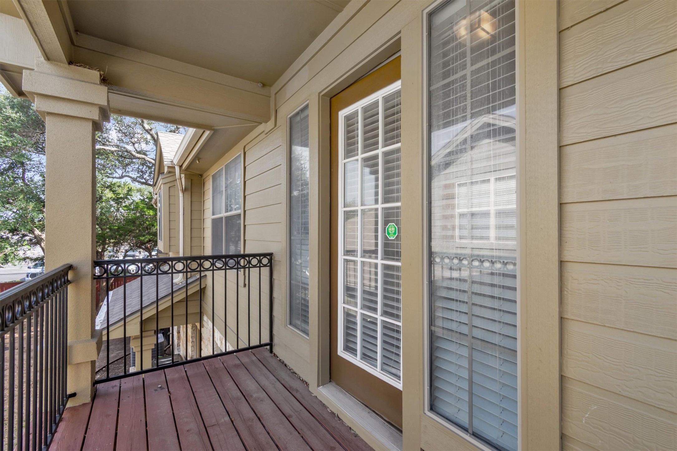 14815 Avery Ranch Boulevard, Unit 2A Austin, TX 78717 - Photo 23 of 27 A quaint covered porch with a durable wood floor, perfect for enjoying peaceful moments outdoors.