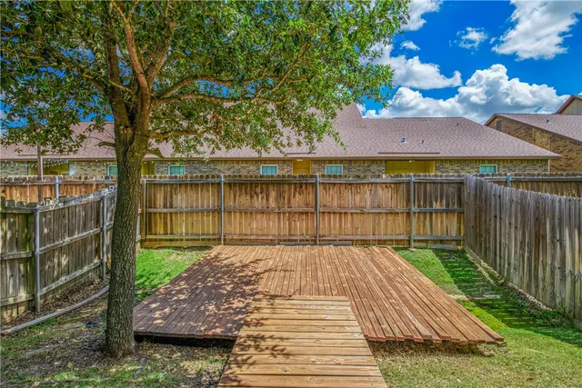 a view of a backyard with a patio