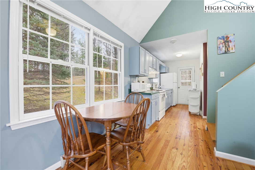 476 Moon Ridge Road Crumpler, NC 28617 - Photo 4 of 35 a dining room with furniture and wooden floor