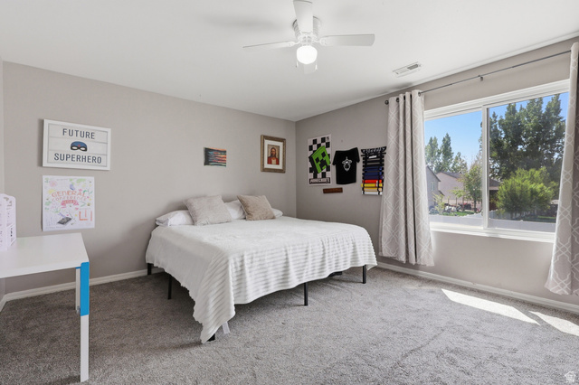 1652 West 800 South Lehi, UT 84043 - Photo 22 of 27 Carpeted bedroom with a ceiling fan and baseboards