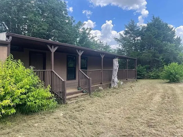 a backyard of a house with lots of green space