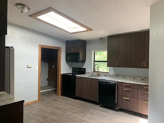 N/a N/a S Cr Road North Anna, TX 75409 - Photo 6 of 13 a kitchen with granite countertop cabinets stainless steel appliances a sink and a window