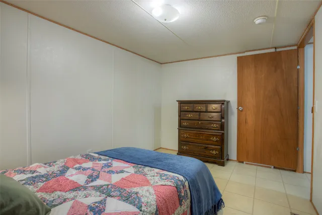 a kitchen with stainless steel appliances kitchen island granite countertop a stove and a refrigerator