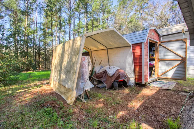 a view of a back yard with a deck