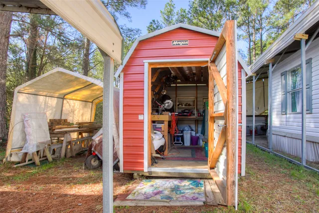 a balcony with chairs and a table