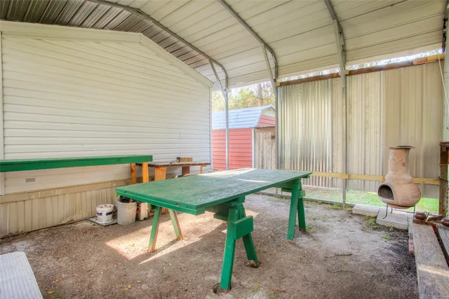 a view of a backyard with potted plants