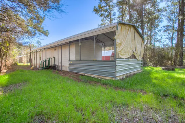 a backyard of a house with lots of green space