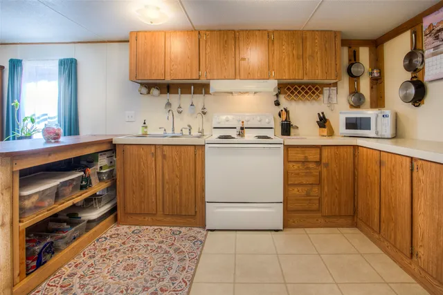 a kitchen with a cabinets and window