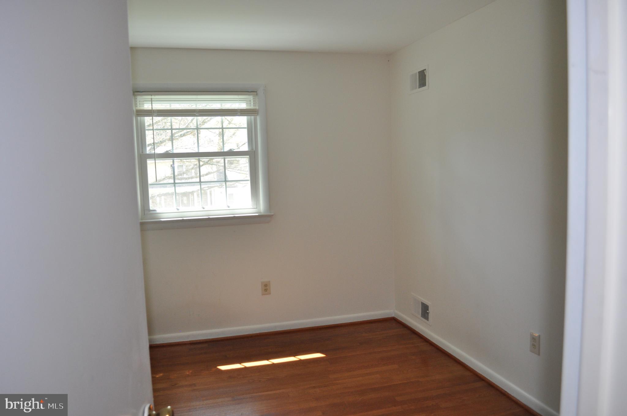 11809 Milbern Drive Potomac, MD 20854 - Photo 18 of 36 an empty room with a window
