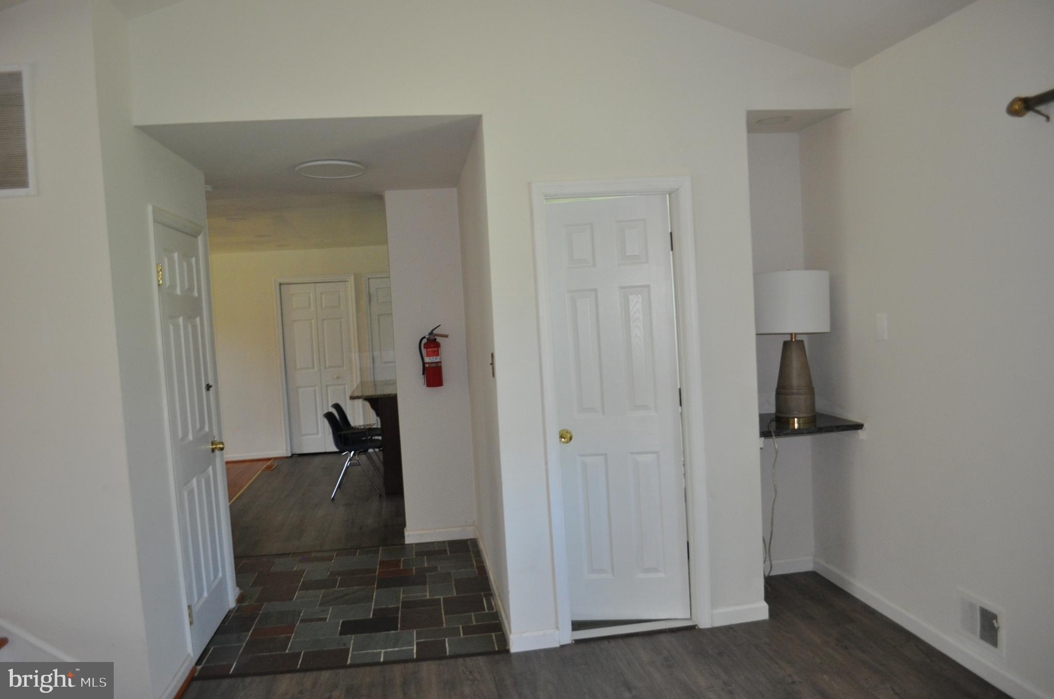 11809 Milbern Drive Potomac, MD 20854 - Photo 22 of 36 a view of a hallway with wooden floor and closet