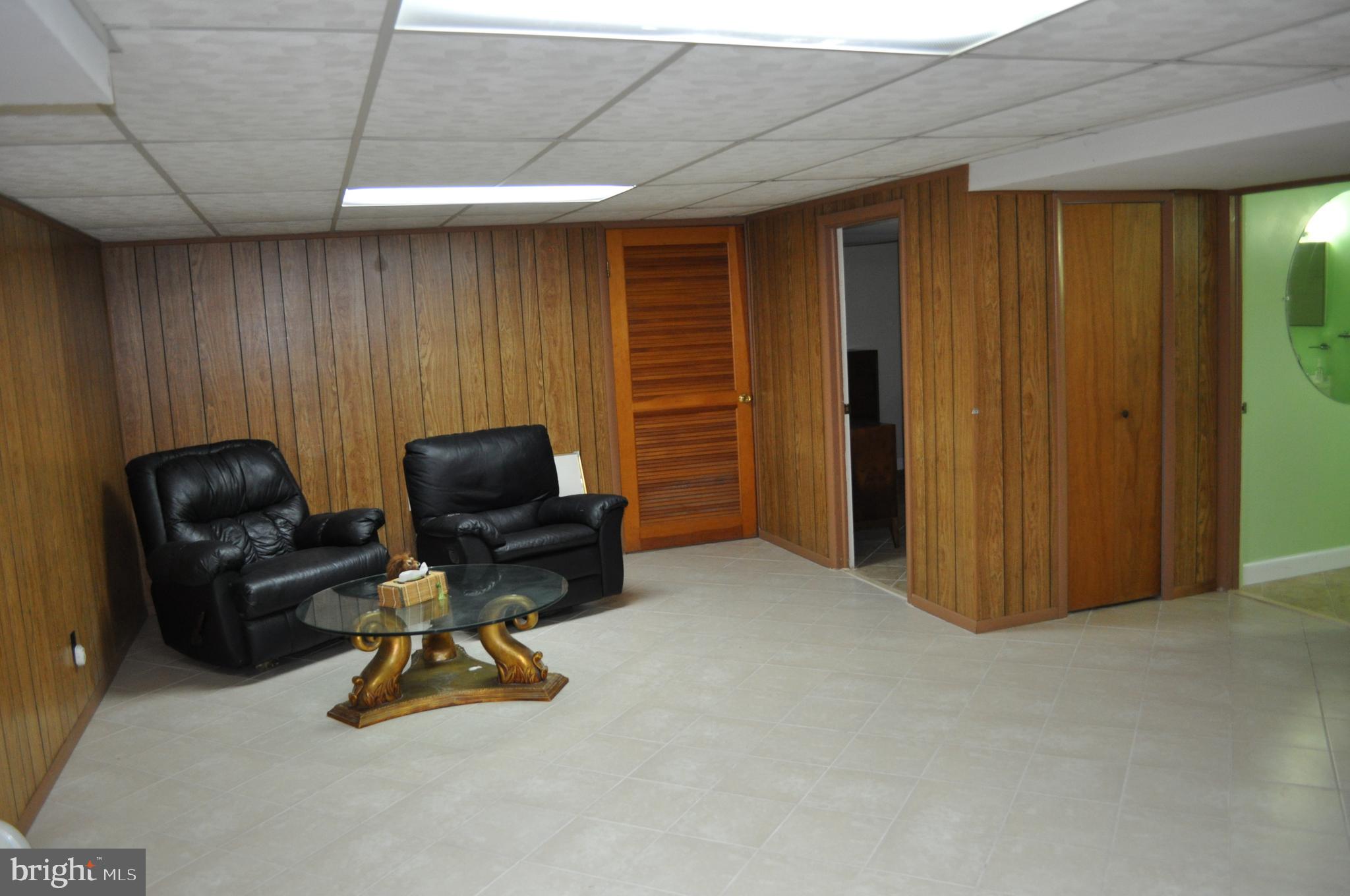 11809 Milbern Drive Potomac, MD 20854 - Photo 25 of 36 a view of a livingroom with workspace and a window