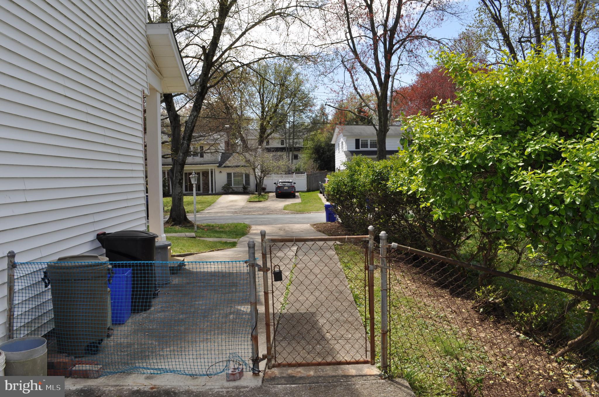 11809 Milbern Drive Potomac, MD 20854 - Photo 31 of 36 a backyard of a house with lots of green space