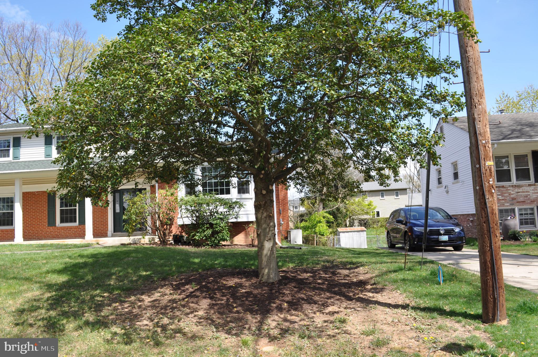 11809 Milbern Drive Potomac, MD 20854 - Photo 32 of 36 a view of a house with a yard