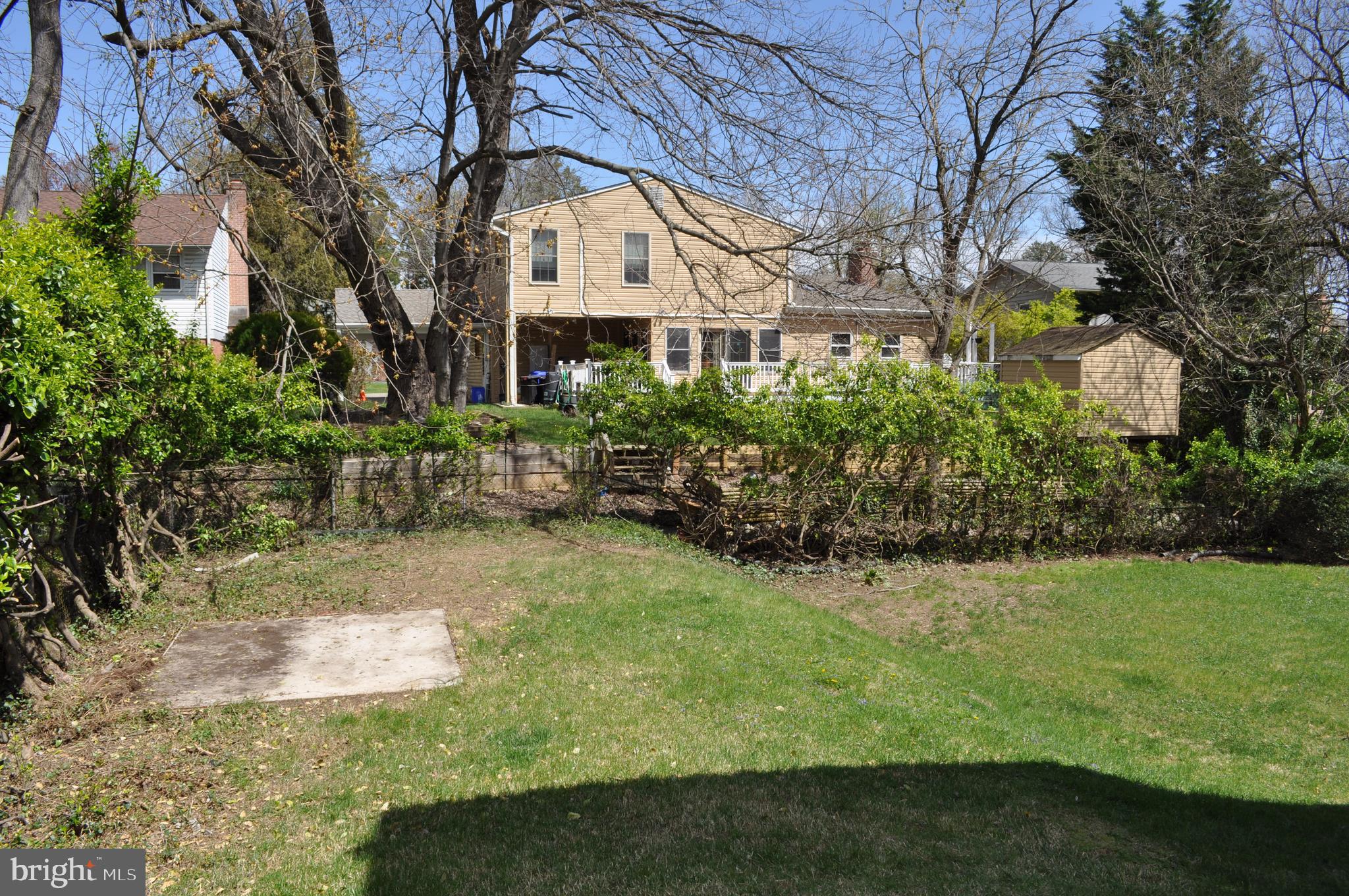 11809 Milbern Drive Potomac, MD 20854 - Photo 33 of 36 a front view of a house with a yard