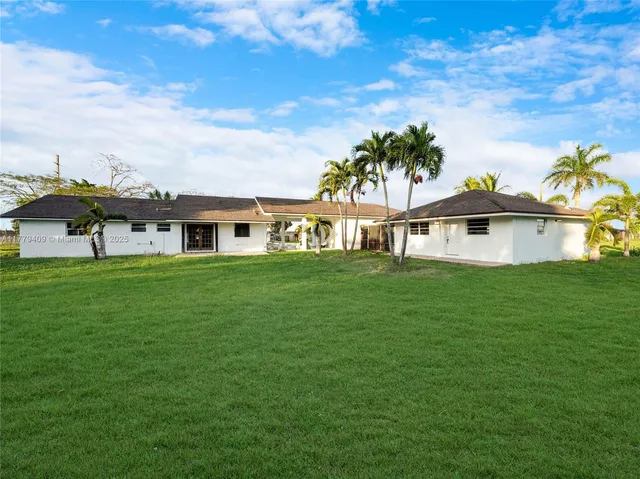 a view of a house with a big yard