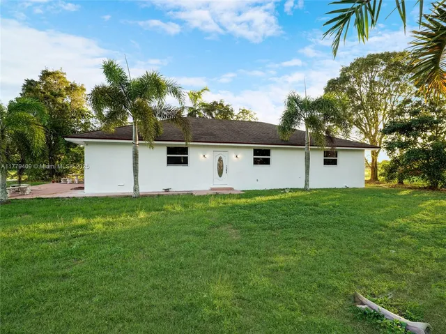 a backyard of a house with seating space