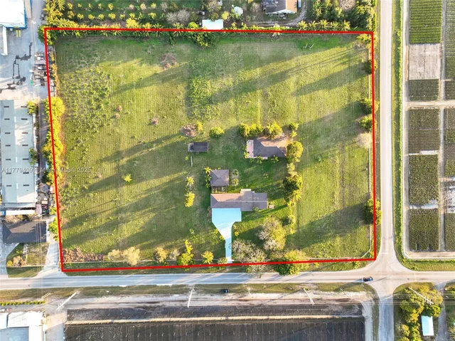 a view of a swimming pool with a yard