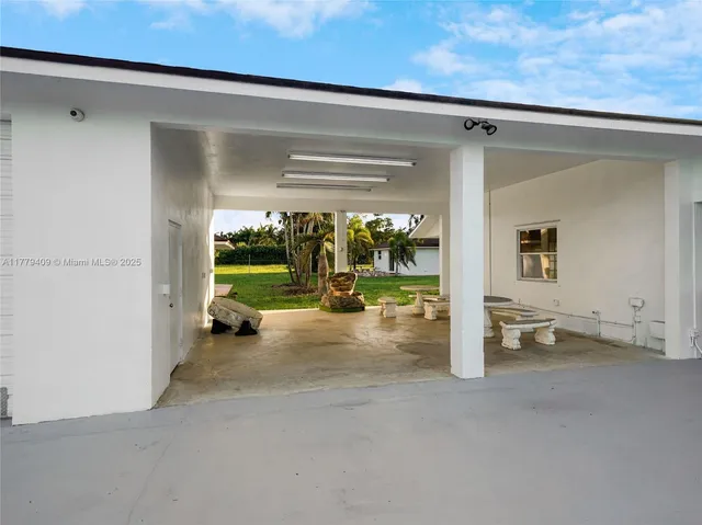 a view of a room with a large window