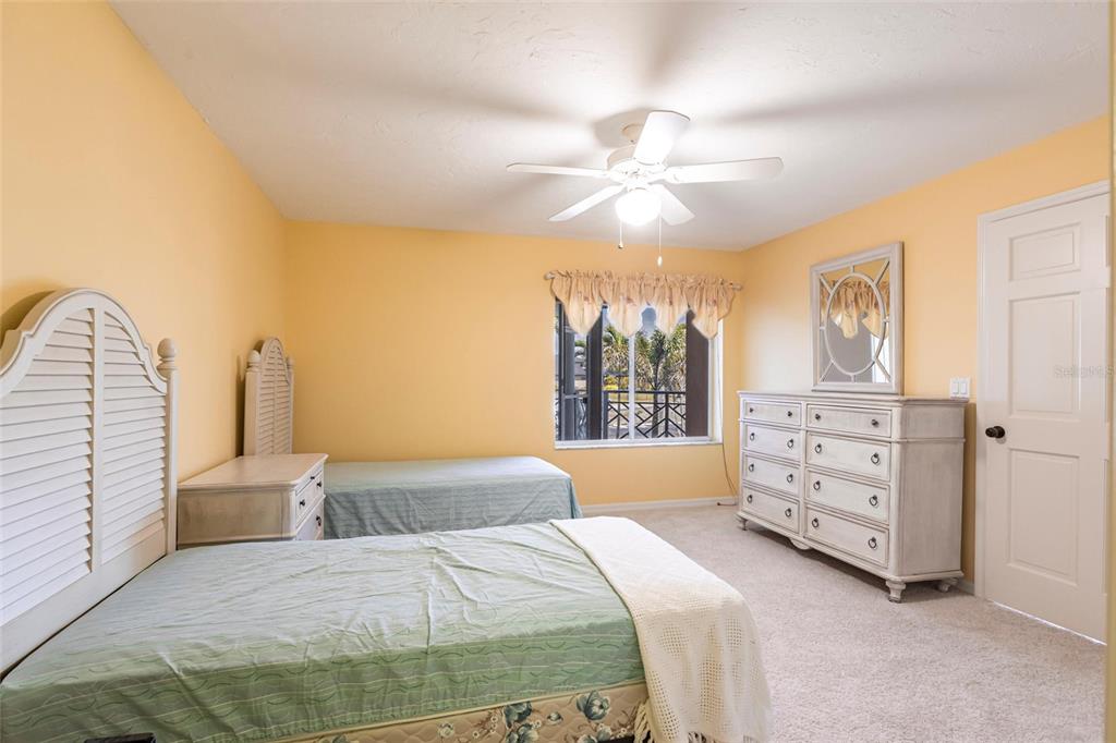 11000 Placida Road, Unit 1501 Placida, FL 33946 - Photo 27 of 46 a bedroom with a bed and a chandelier